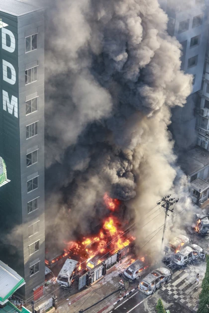 Bangladesh wakes to torched government buildings as 100 police officers injured in protests