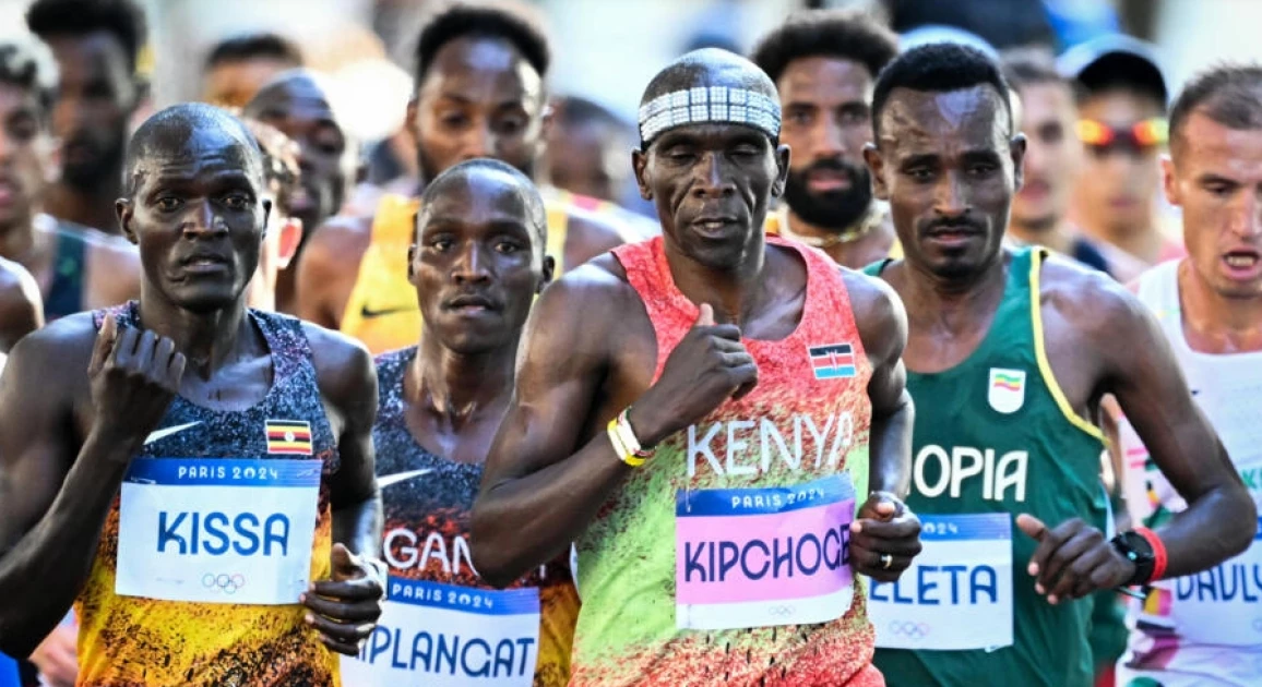 Marathon great Kipchoge hangs up his shoes, literally