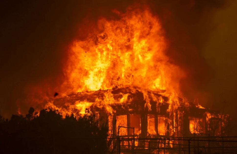 Woman sets house ablaze while husband, 2 children were asleep 