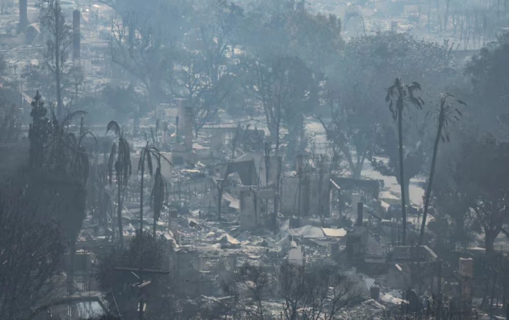 Los Angeles wildfires devour thousands of homes even as fierce winds ease