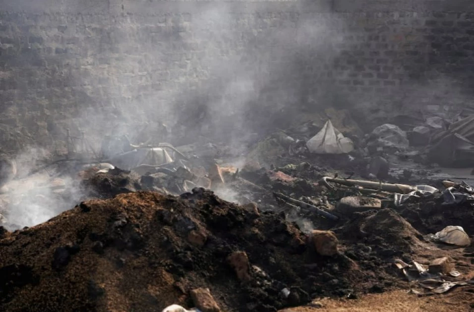 Charred bodies, shattered lives after gunmen kill 100 in Nigeria