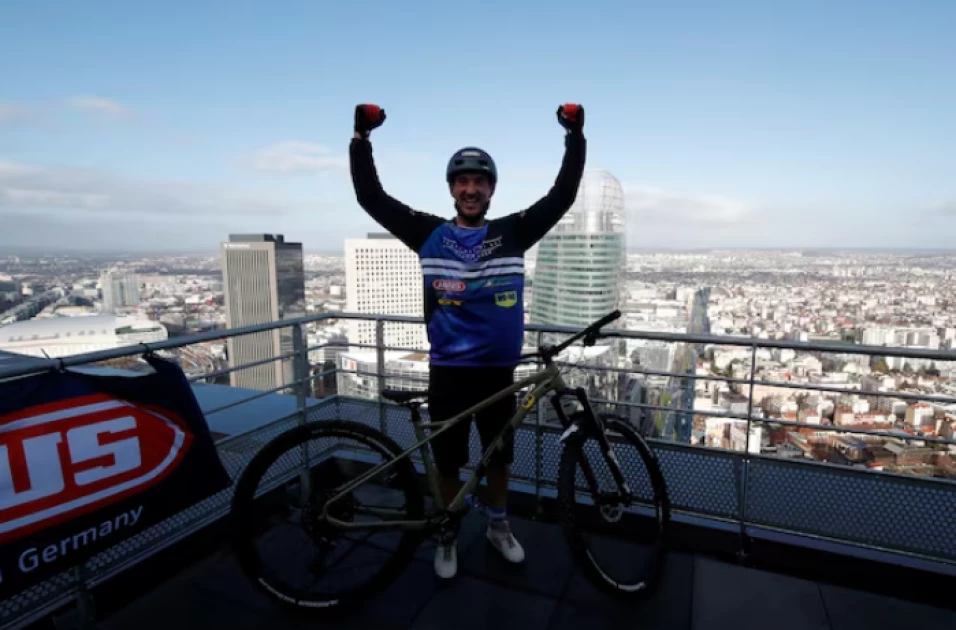 Social media star Fontenoy breaks world record cycling up Eiffel Tower