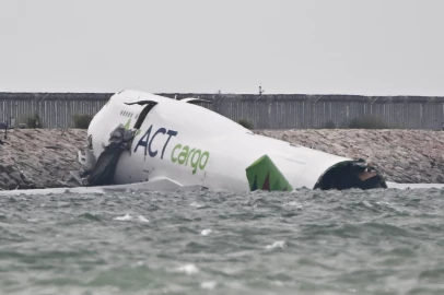 Two killed as cargo plane skids off Hong Kong runway
