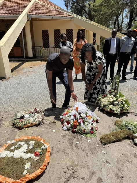 PS Oluga, wife return to Raila's gravesite day after burial PS Oluga, wife return to Raila's gravesite day after burial