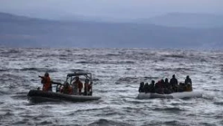 Coastguard rescue 52 migrants off Greece, boy missing