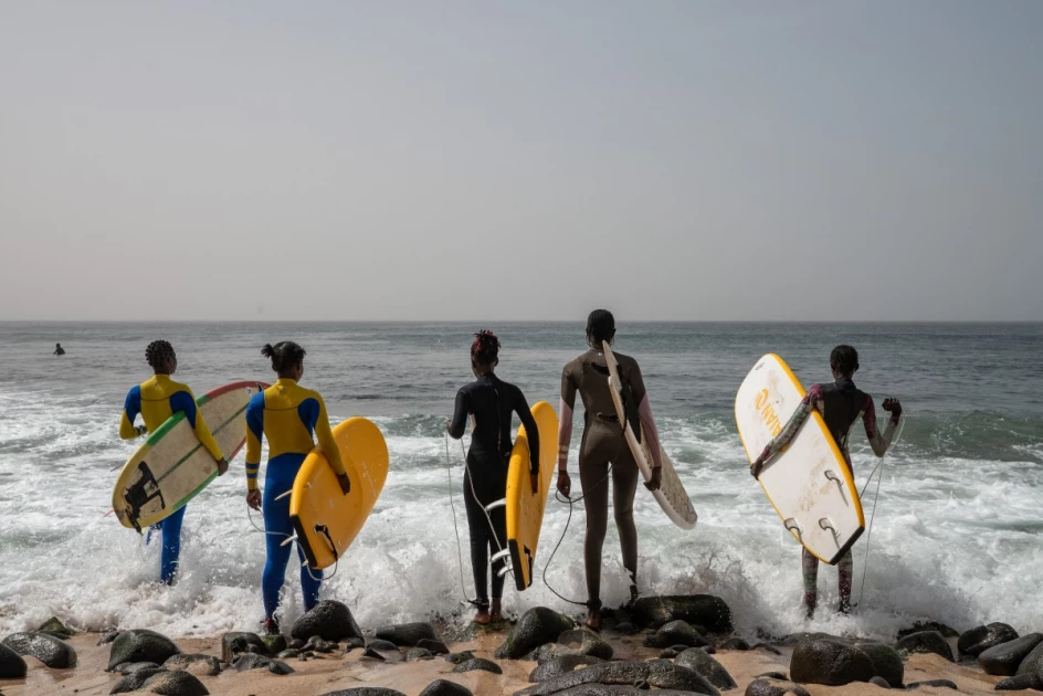 In Dakar fishing village, surfing entices girls back to school