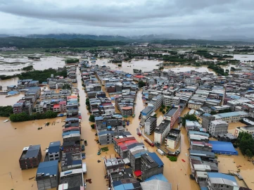 Heavy rains kill two, force evacuations in south China
