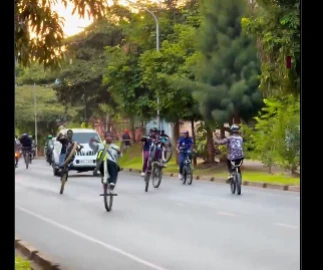 Outrage after young cyclists captured performing dangerous wheelie stunts along busy highway
