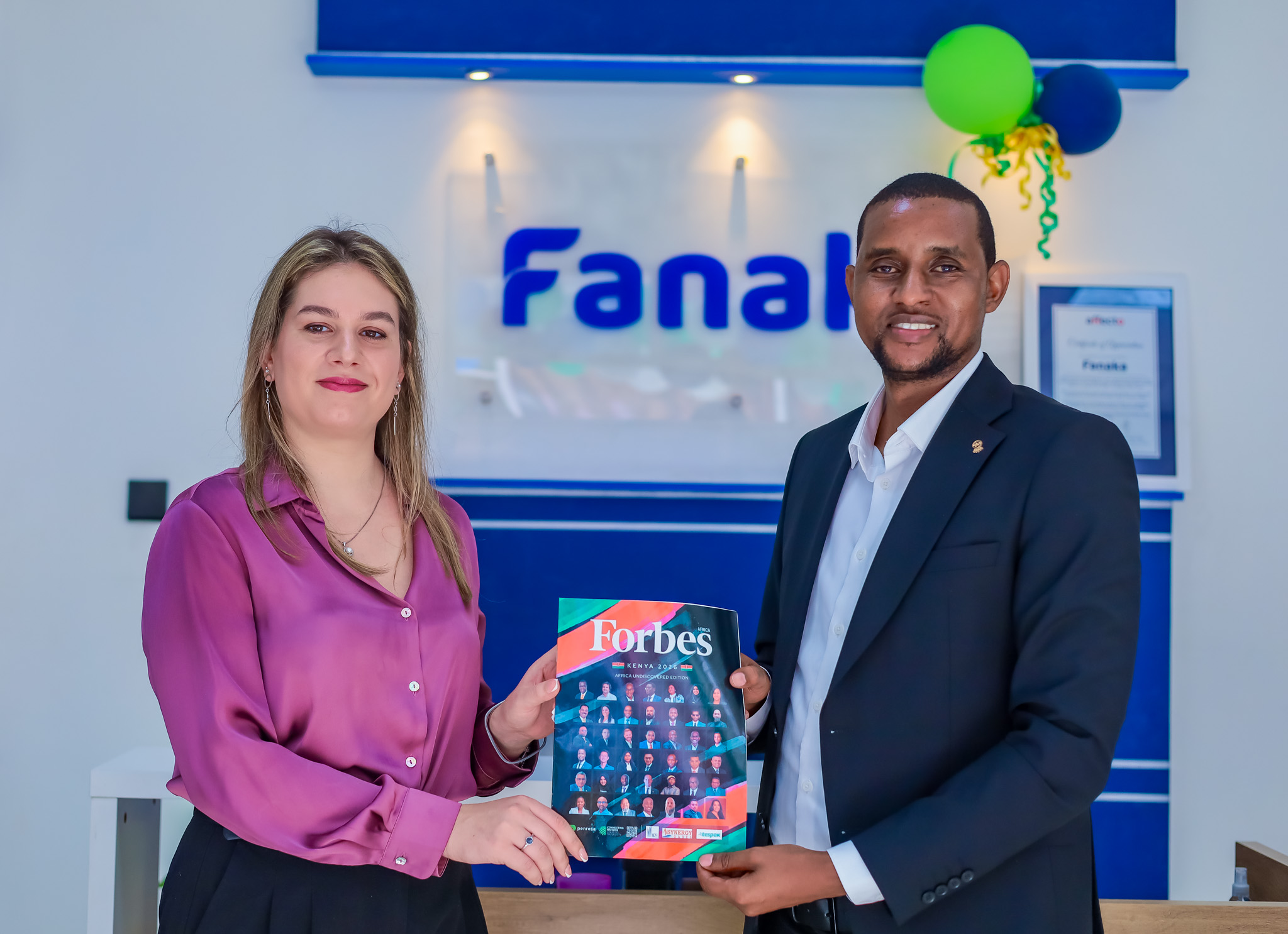 Fanaka CEO Moses Muriithi receives the award from Masha Milanovic of Forbes Africa