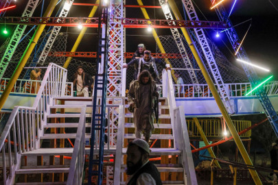 Battle-hardened Taliban fighters enjoy a day off at amusement park